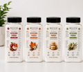 Five BELVIE Refreshing Powder bottles in different fall and citrus flavors, lined up on a white surface against a clean white background with soft decorative plants.